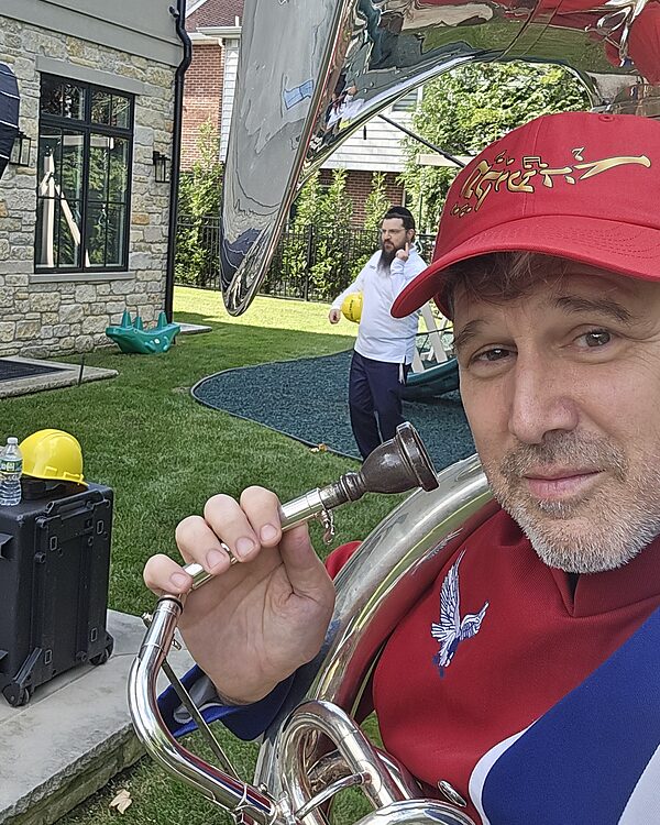 Danny Flam with the sousaphone, in a Tekia cap